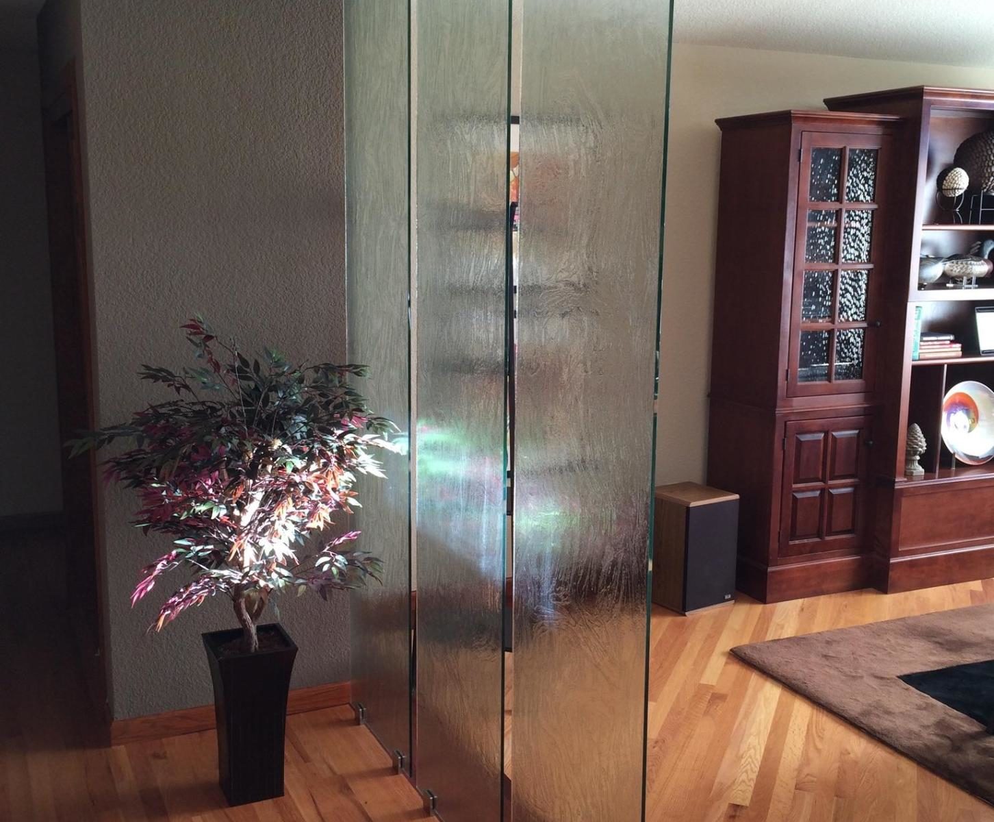 Patterned glass divider panels separate rooms with style