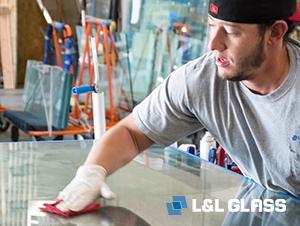 L&L Glass employee at one stage in the glass fabrication process