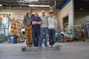 This is a 3/8" clear tempered glass shower door with four members of our installation team standing on it.&nbsp; It bows, but does not break.